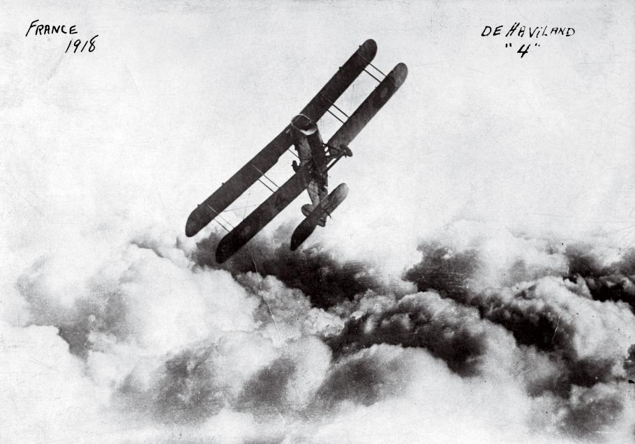 Historic image of a biplane banking to starboard.