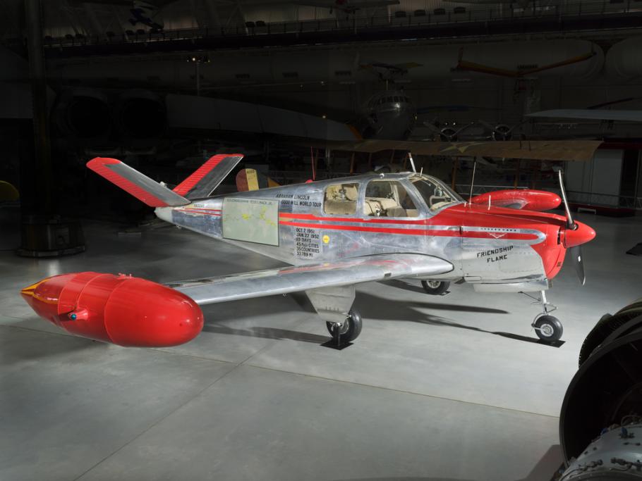 Silver and red painted single engine aircraft with four seats.