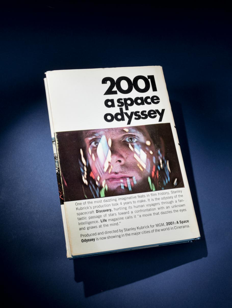 A book titled 2001 A Space Odyssey with a human face on the cover. 