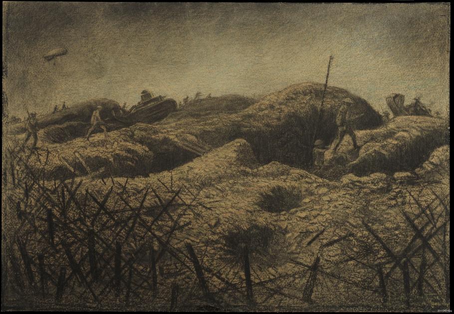 Soldiers walk on top of trenches, barbwire is in the foreground. 