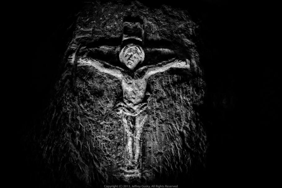 Figure of Jesus on the cross engraved on stone. 