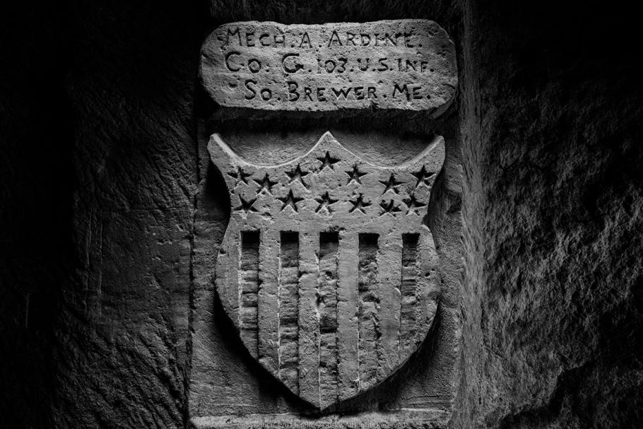 Engraving in stone of stars and stripe emblem. 