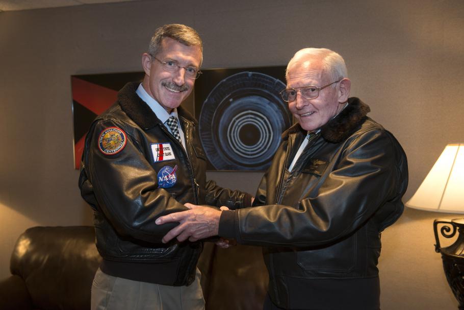 NASA Astronaut and Coast Guard Captain Eugene "Daniel" Burbank stands left of General Jack Dailey, a former Museum Director, on the night of an annual museum lecture.
