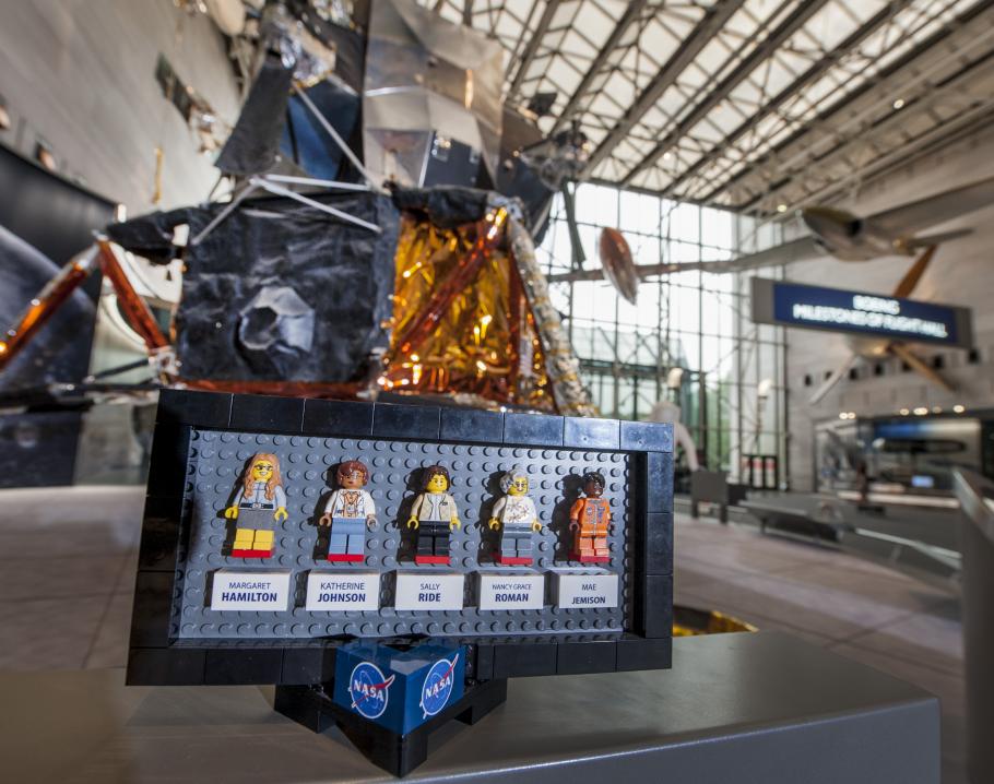 The original prototypes of the LEGO® Ideas "Women of NASA" set displayed in front of the Apollo Lunar Module in the Boeing Milestones of Flight Hall 