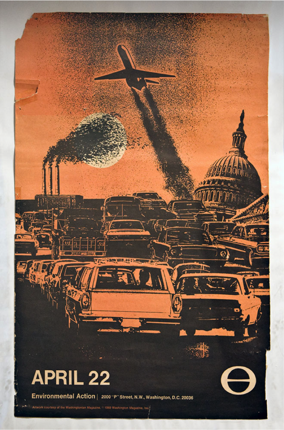 Orange poster featuring traffic and smog. 