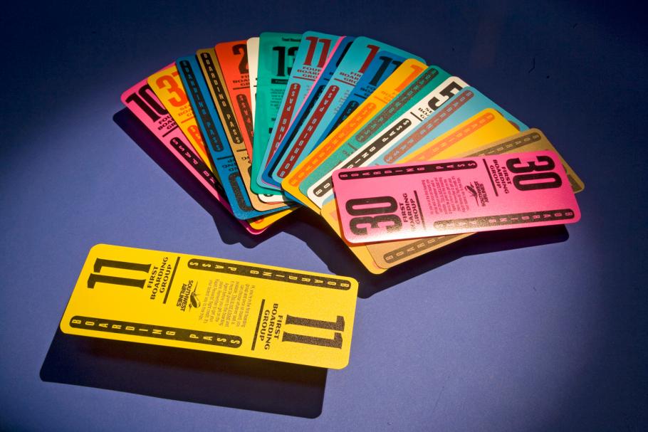 Set of twenty multi-colored, plastic, reusable boarding passes used by Southwest Airlines.