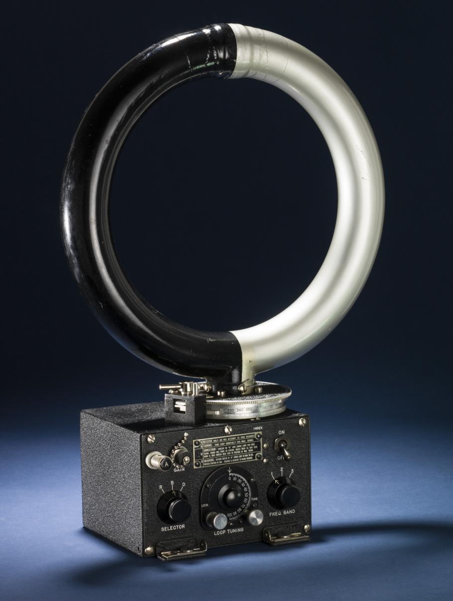 An circular antenna attached to a small rectangular box with various dials.