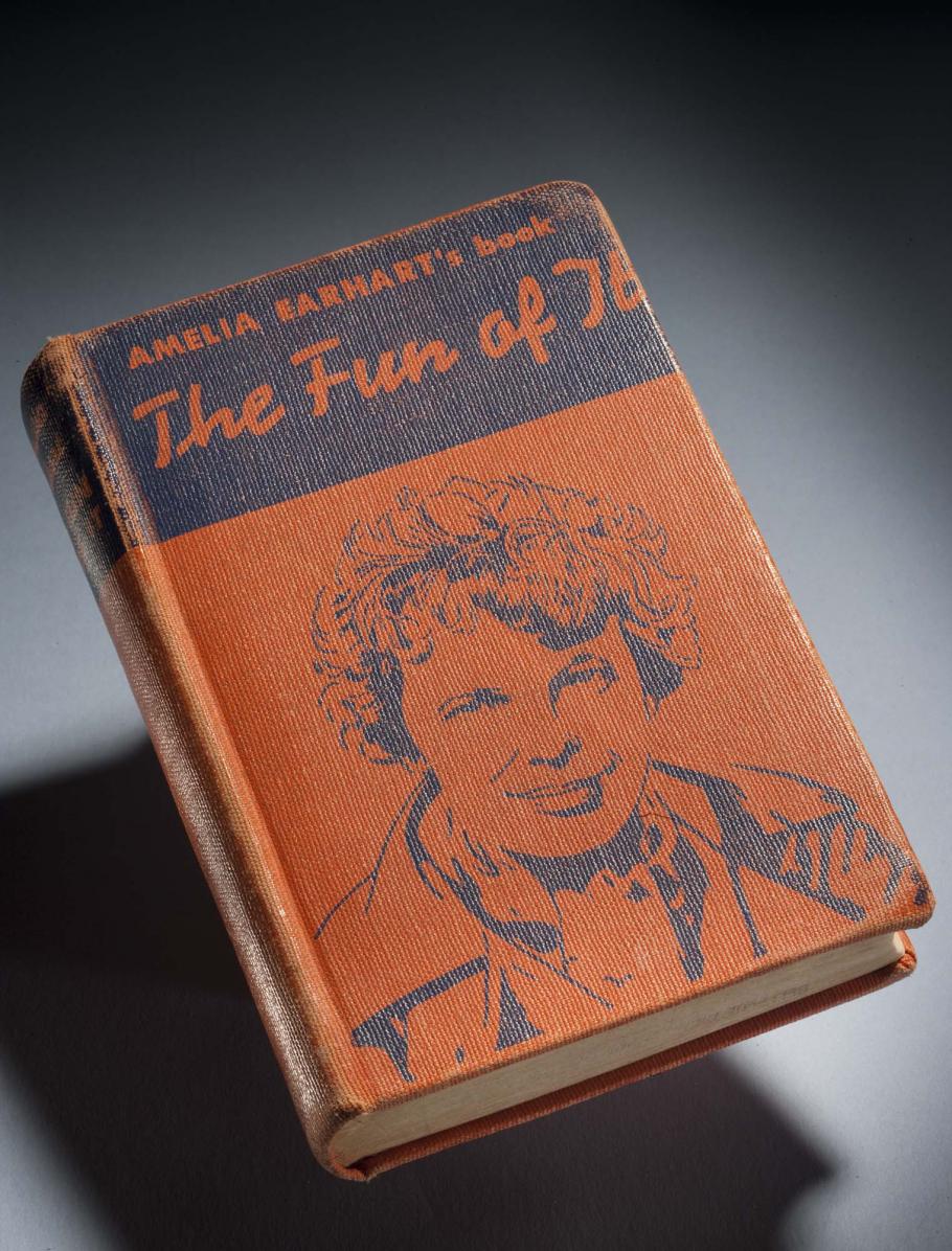 Orange and black book cover featuring a drawing of Amelia Earhart. The book is titled "The Fun of It" and is written by Amelia Earhart.