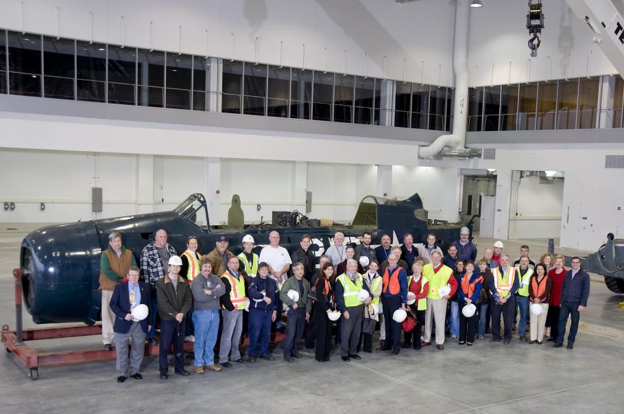 Staff &amp; Supporters Pose in Front of &lt;i&gt;Helldiver&lt;/i&gt;