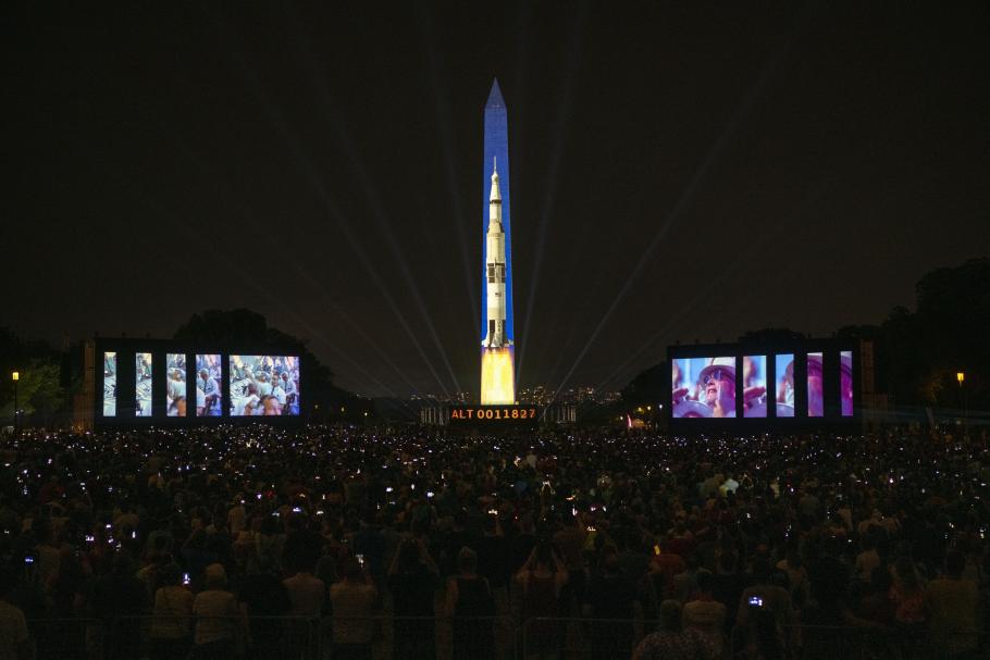 Saturn V rocket projected on Washington Monument