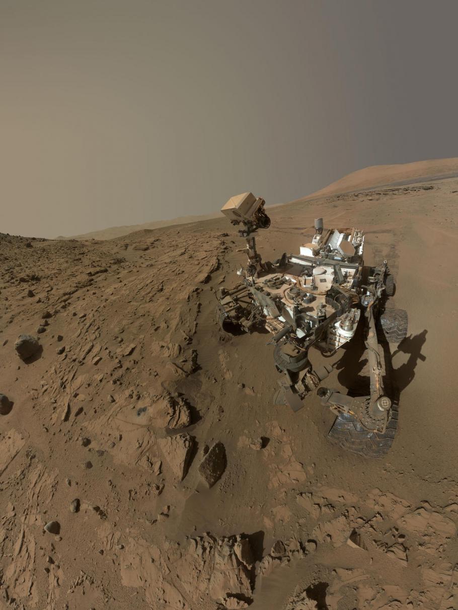 Curiosity, a Mars rover, attempts to take a self-portrait of itself as it stands on a slope section on Mars.