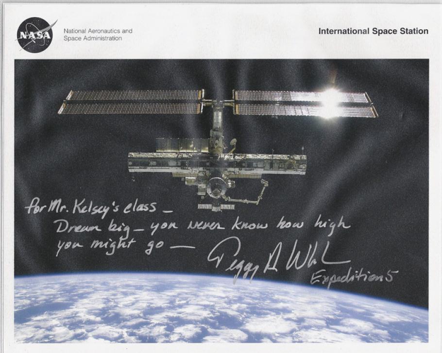 An image of the ISS with a note scrawled on top. 