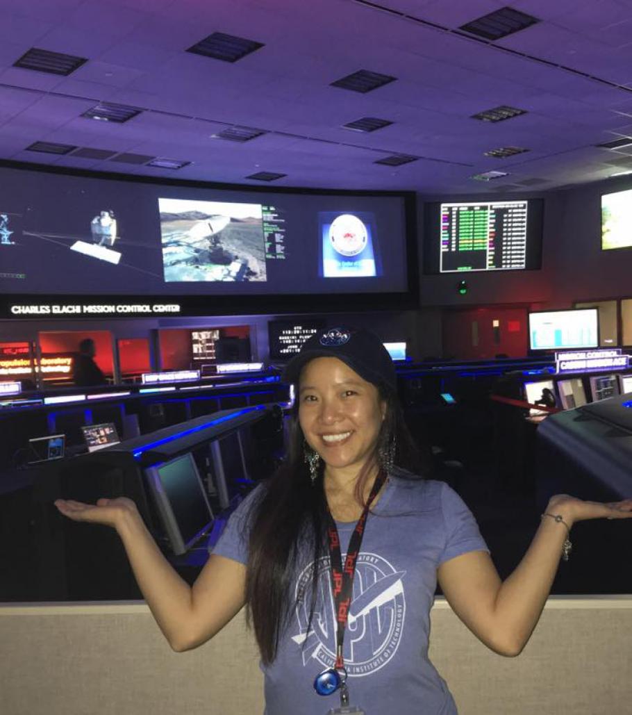 Programmer Melody Ho standing inside mission control at the NASA Jet Propulsion Lab
