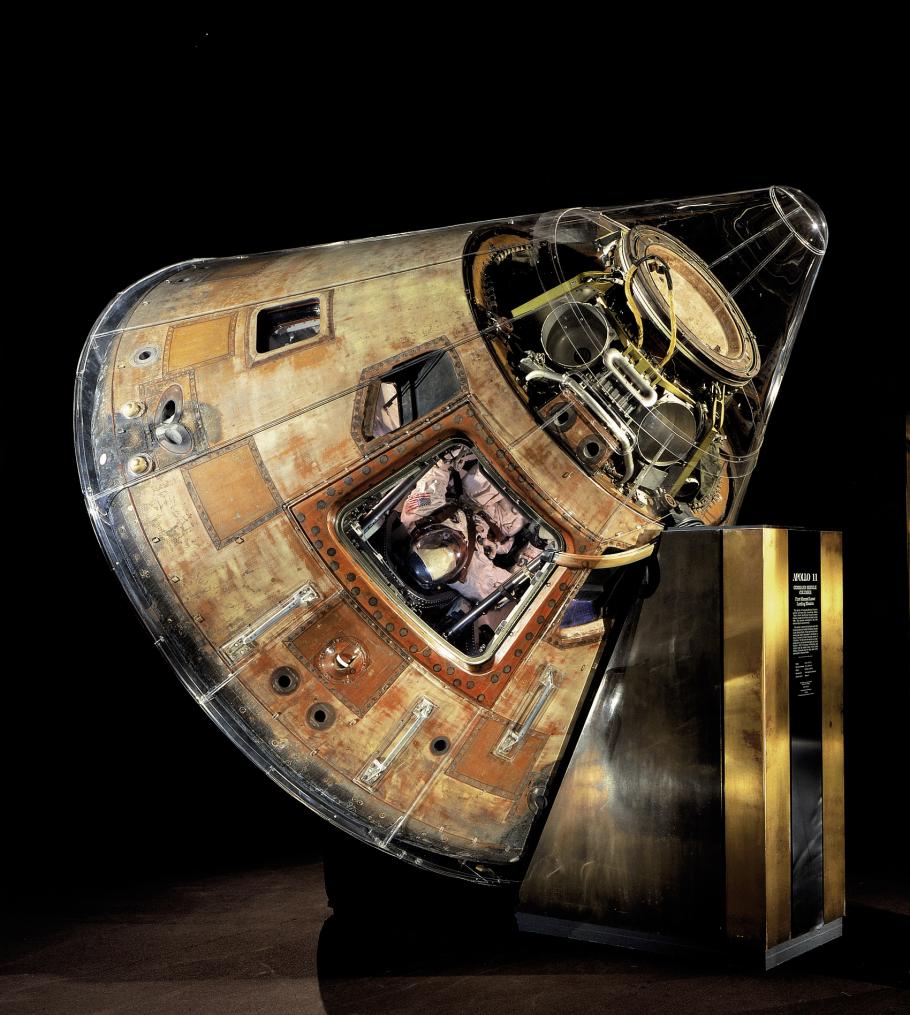 Apollo 11 command module Columbia, a cylindrical object large enough to hold humans, on display in the museum