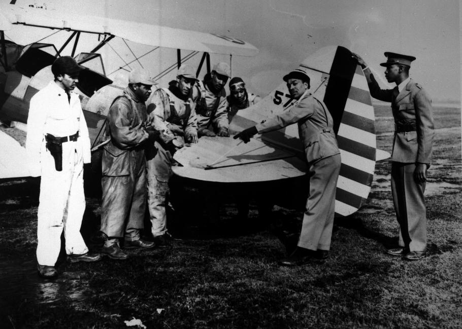 Seven men with an airplane