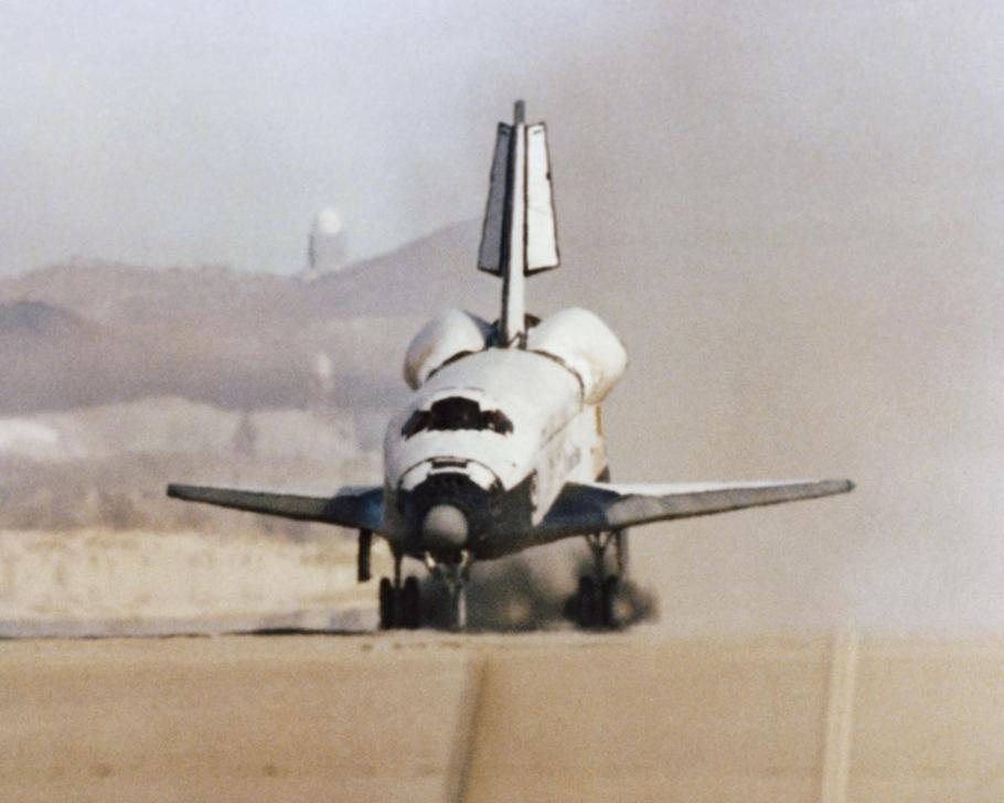 The Space Shuttle Columbia touches down on the runway at Edwards Air Force Base, Calif., to conclude the first orbital shuttle mission, 1981.