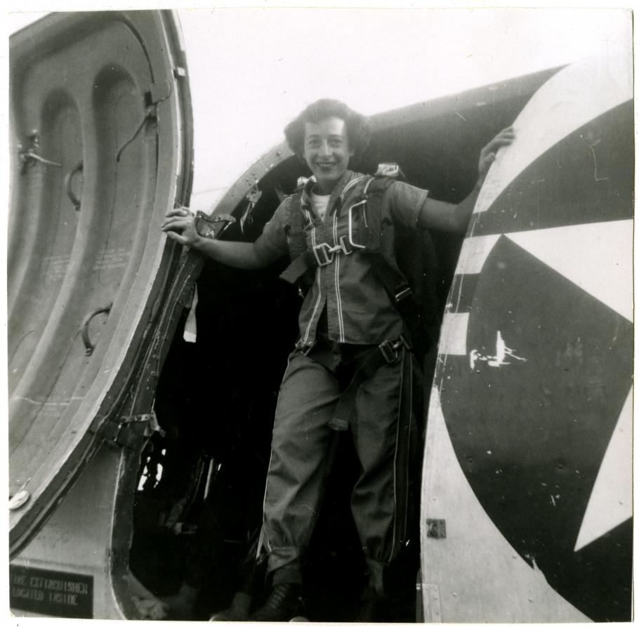 View of Helen G. James posed inside the main cargo door of a Douglas C-47 Skytrain. 