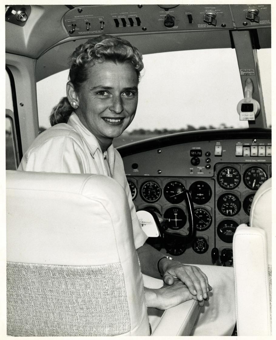 Woman in cockpit of aircraft