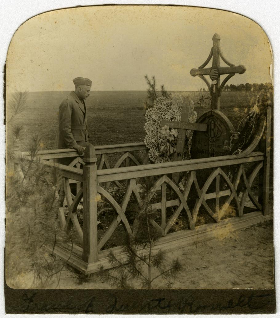 Soldier standing by grave of Quentin Roosevelt