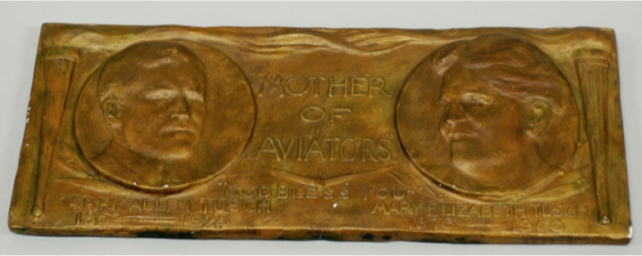 Bronze commemorative plaque showing image of Mother Tusch