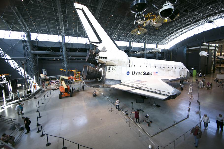 Discovery in space hangar surrounded by digitization equipment