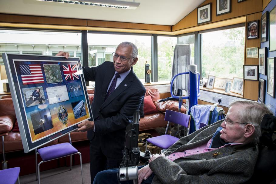 NASA Administrator Charles Bolden presents a commemorative NASA montage to Professor Stephen Hawking