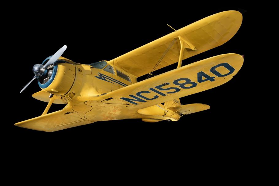 Overall view of yellow Beechcraft C17L Staggerwing aircraft