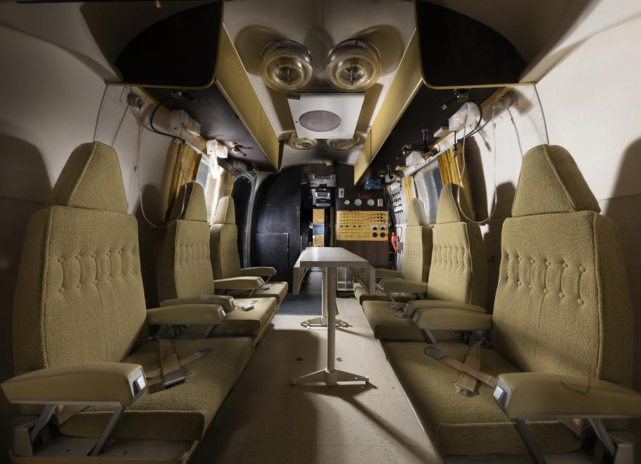 interior view of the Mobile Quarantine Facility, which includes six seats, six bunks, kitchen and bathroom.