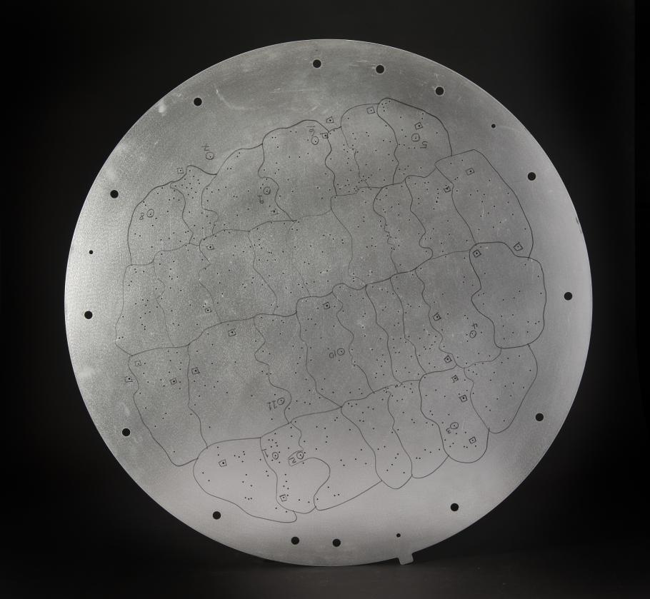 Circular aluminum plate used at the focal plane of the Sloan Survey telescope.