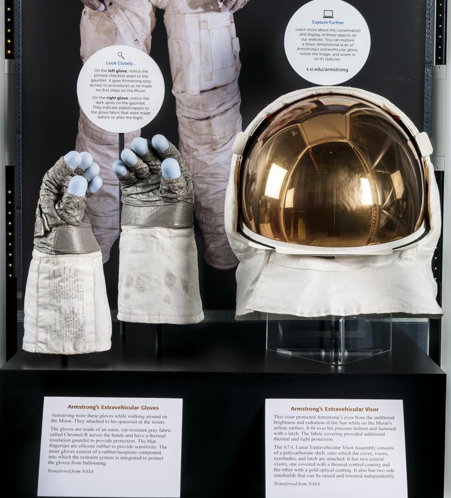Close up view of Neil Armstrong's gloves and helmet from the Apollo 11 mission
