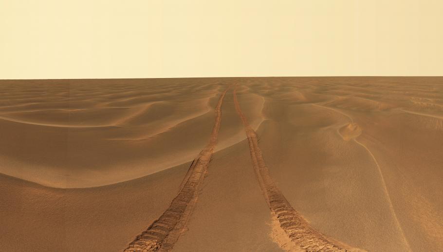 An area of sand dune plains on Mars, with tracks from Opportunity rover's path visible.