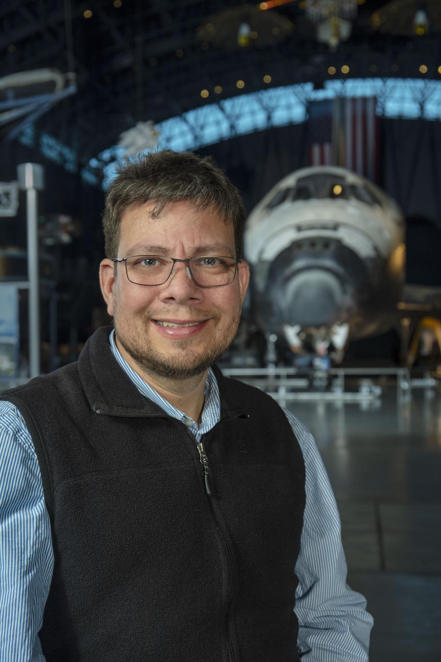 Francisco Torres in front of the space shuttle Discovery