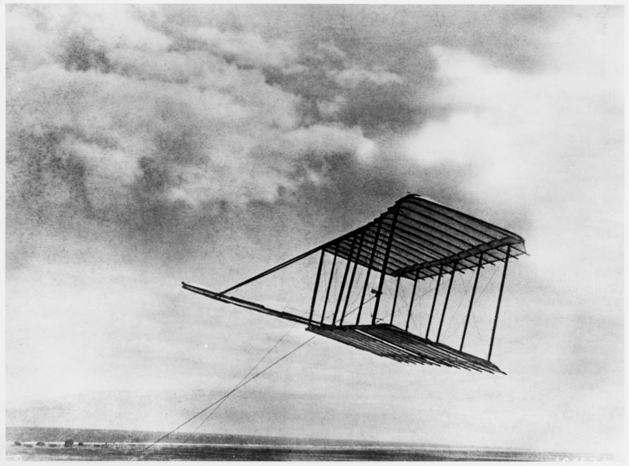 One-quarter front left side view of Wright 1900 Glider being flown as a kite.