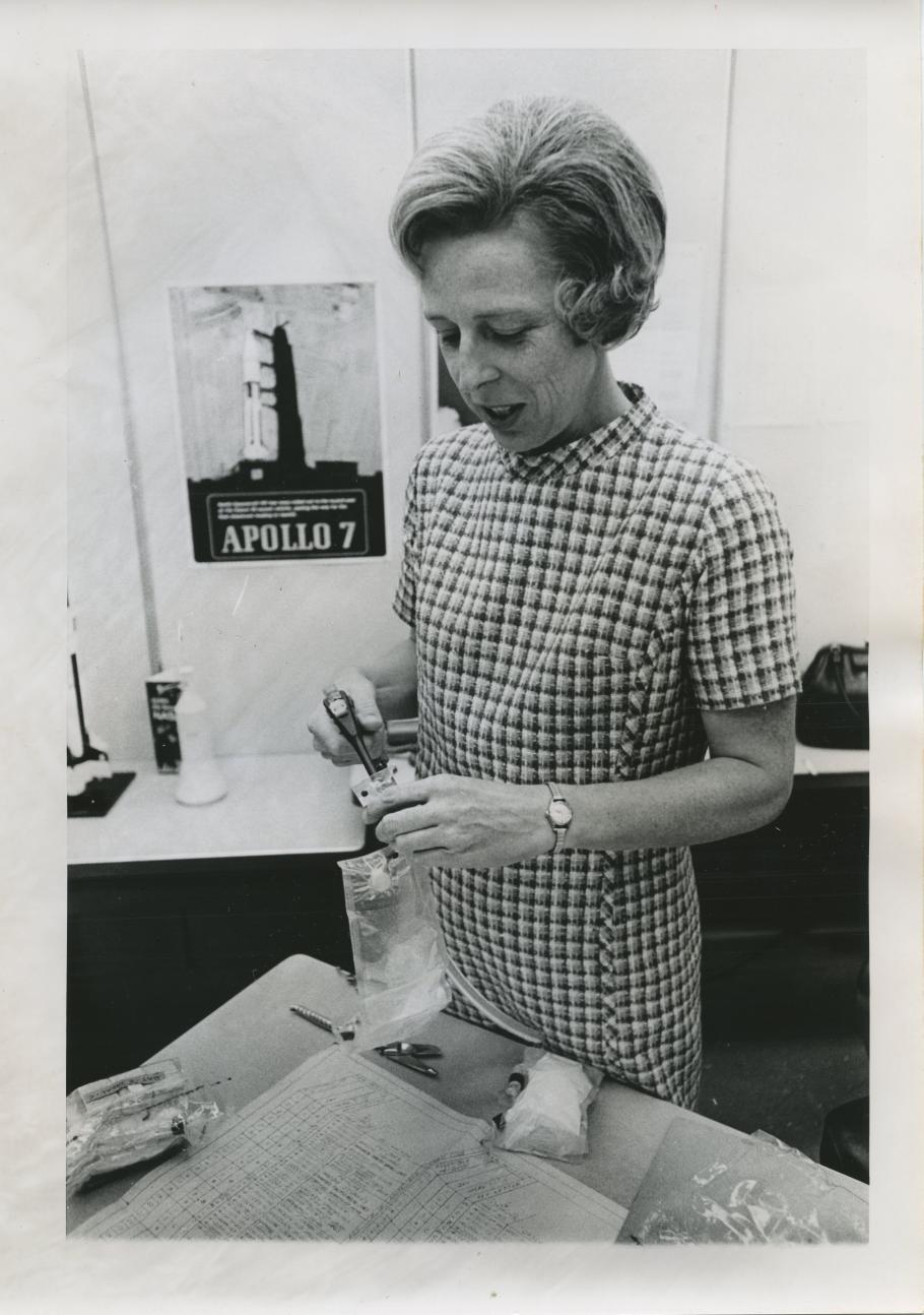 Rita Rapp carefully stows a bag of frankfurters besides labeled meal packages.