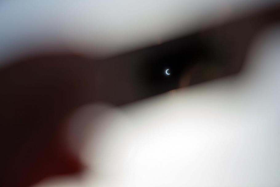 A fuzzy picture of what the eclipse looks like through safe eclipse glasses. 