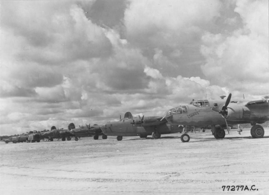 B-24s, B-25s, and B-26s sit on the ramp at Val De Case Airfield