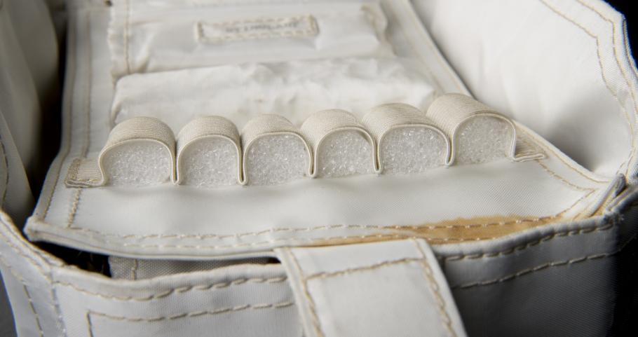 View of archival foam inserts placed in voided compartments within the medical accessory kit.