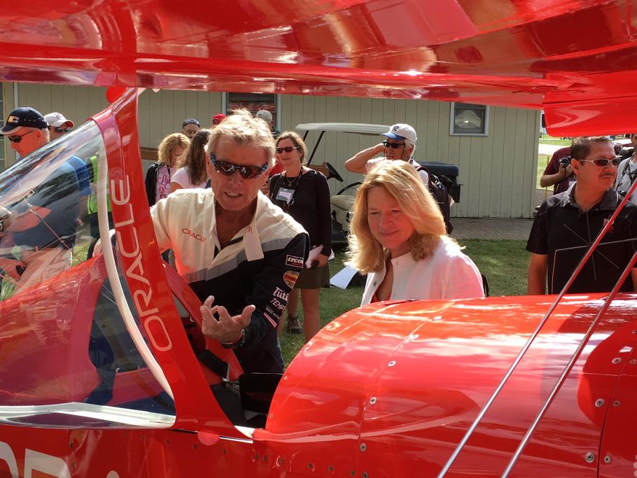 Dr. Ellen Stofan with Aviator Sean D. Tucker and his Oracle Challenger III biplane.