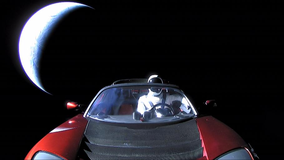 red car with mannequin in space