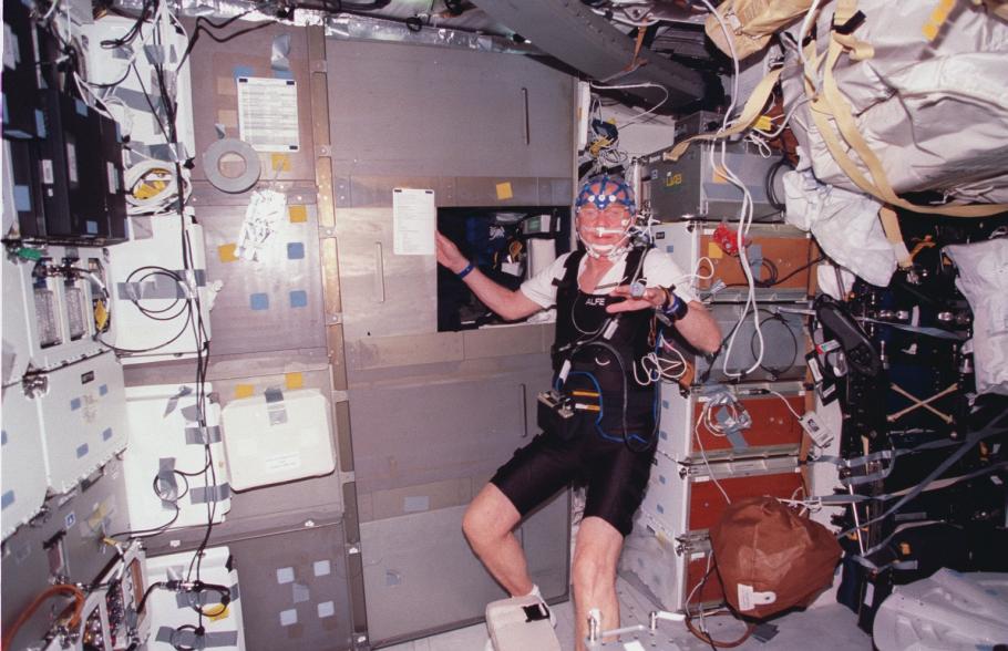 John Glenn on STS-95 wearing experiment sensors and other equipment. 