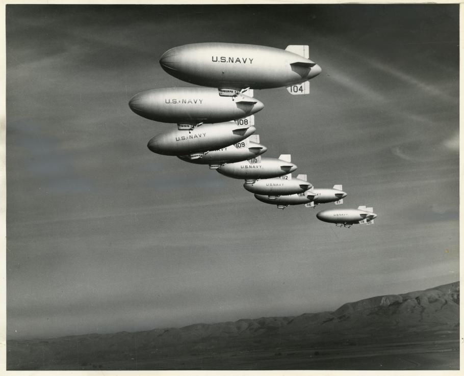 nine airships flying