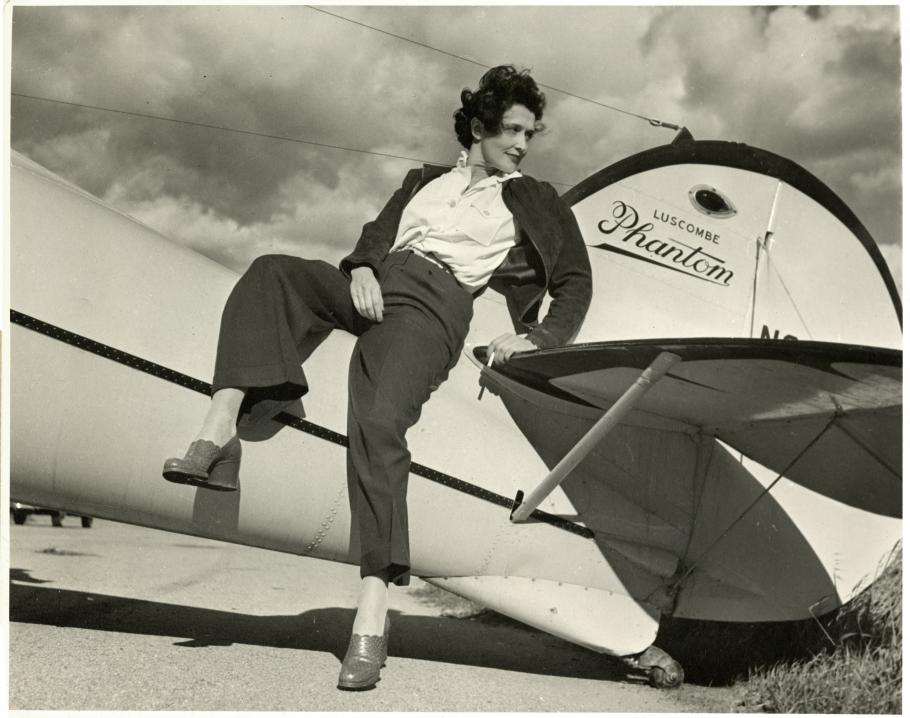 woman standing by aircraft