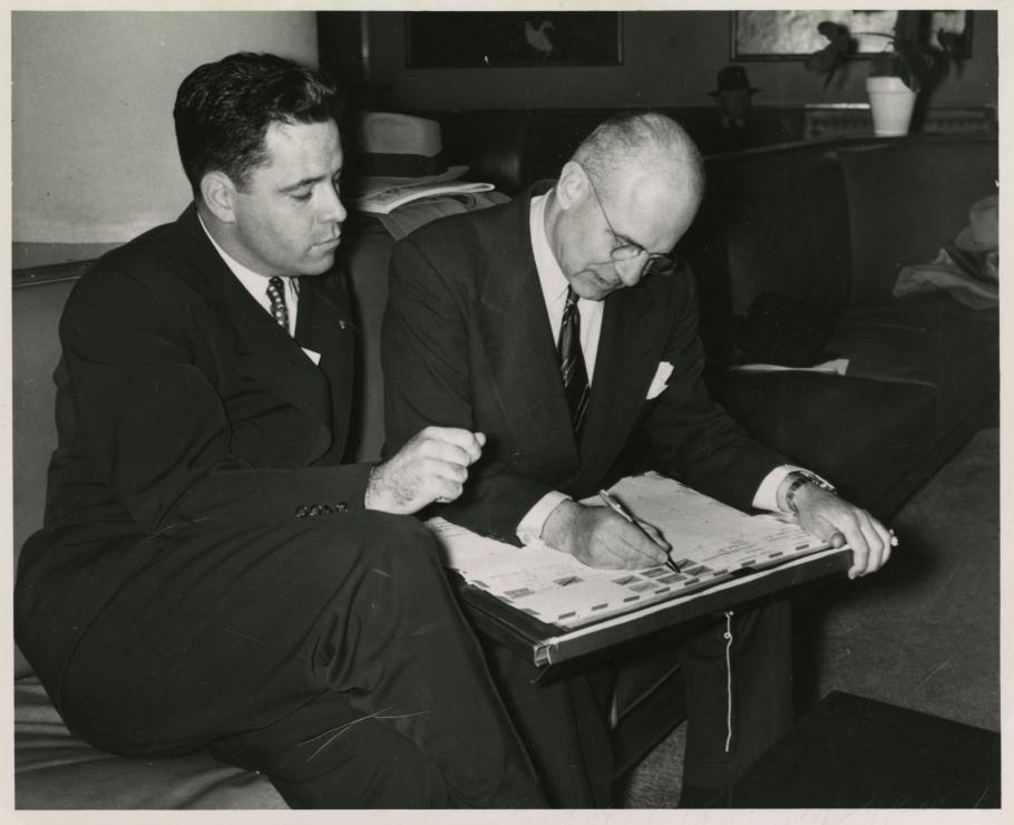 Jimmy Doolittle Signs the 1949 Around the World Envelope while Lanphier watches