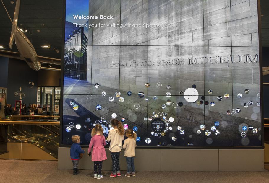 Children try out an interactive display in the Boeing Milestones of Flight Hall 
