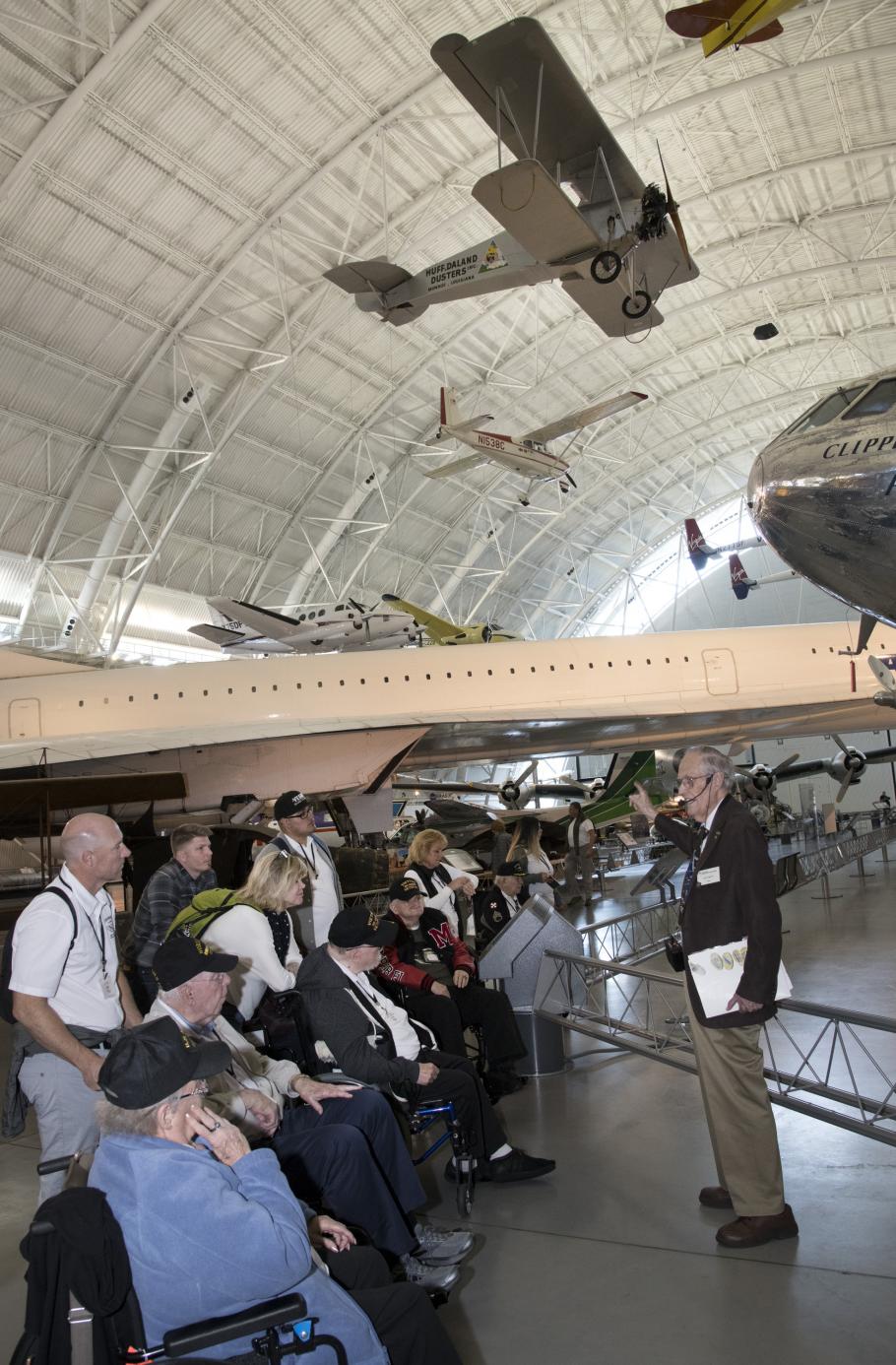A group of veterans&nbsp;touring the Steven F. Udvar-Hazy Center in Chantilly, VA with a docent.