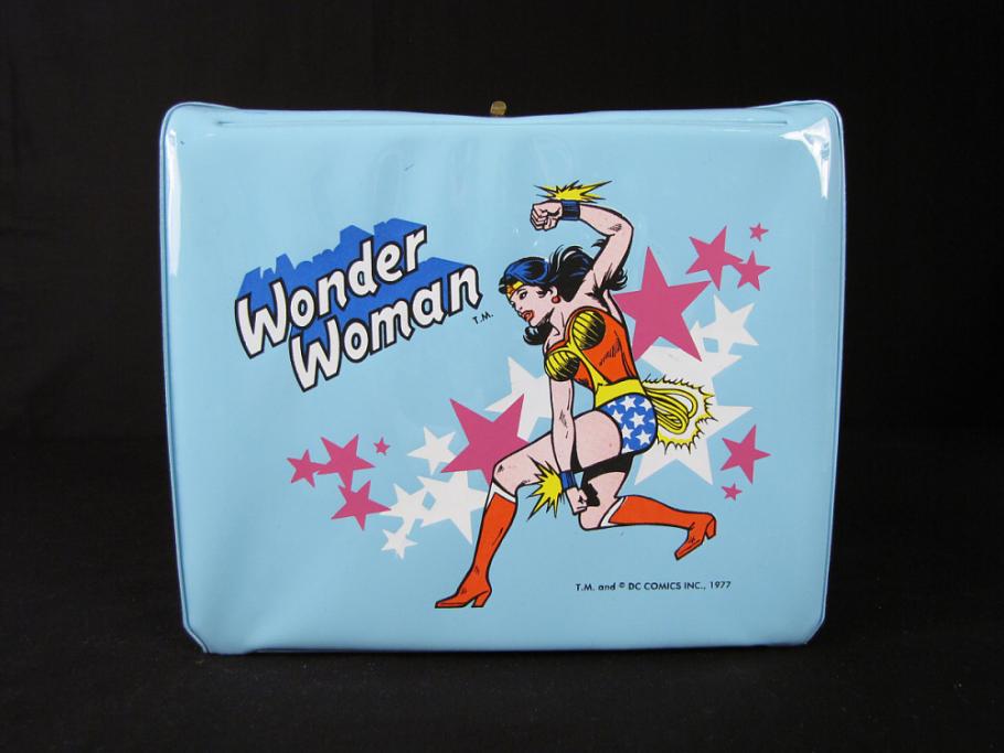 blue lunchbox with Wonder Woman on it, against a black background
