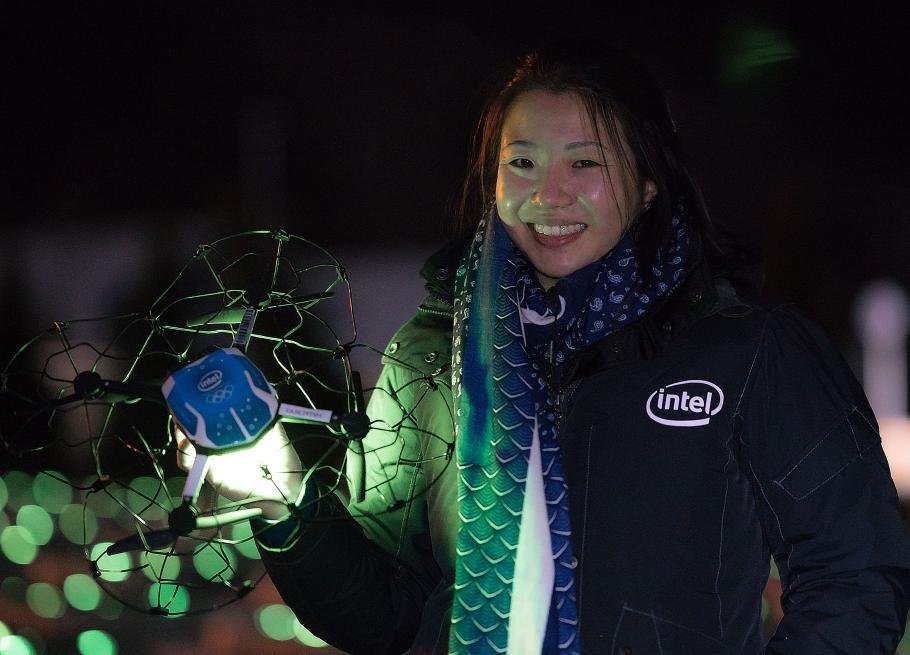 Natalie Cheung holding one of Intel Shooting Star drones used during the Winter Olympics Opening Ceremony. 