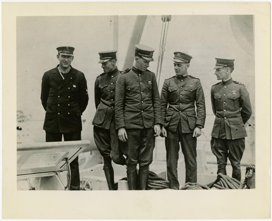 Five men in naval uniforms
