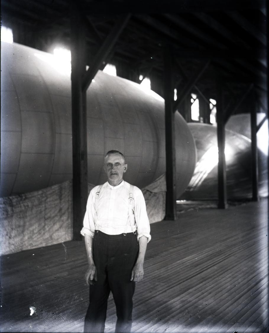 Man in front of balloon in factory