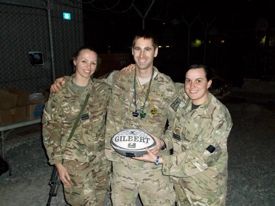 Royal Air Force Flt. Lt. Sarah Cole sharing a love of rugby with members of the United States Air Force in Afghanistan. 